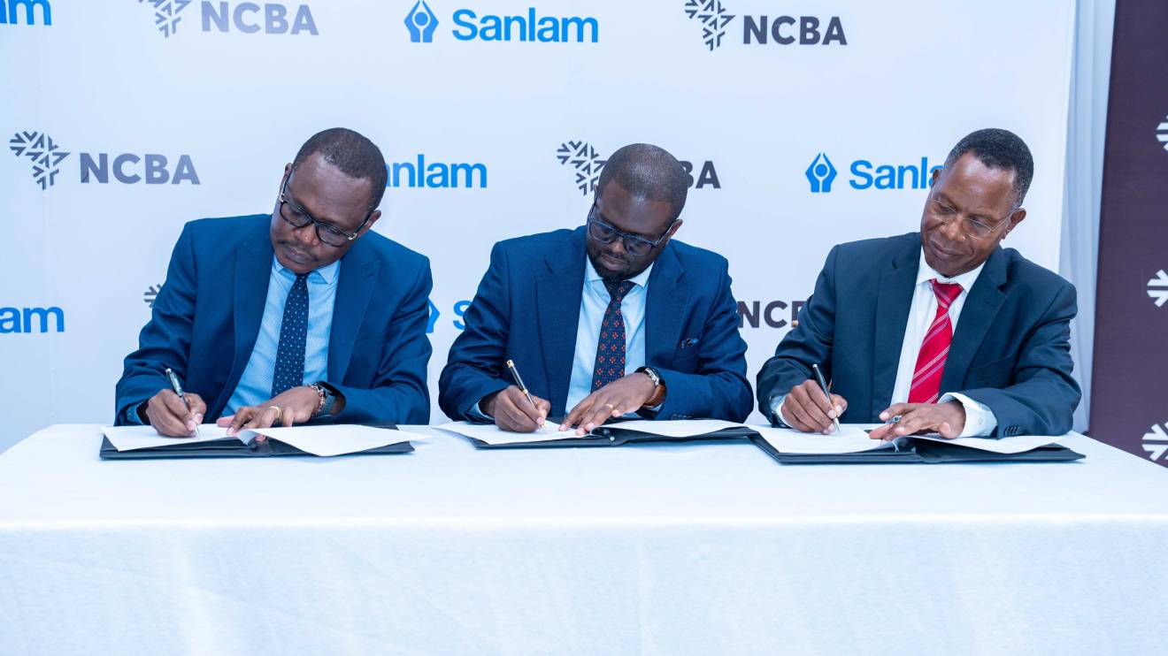 Lennox Mugambi, Samuel Odhiambo and Nyamemba Tumbo signing the MoU. PHOTO/COURTESY